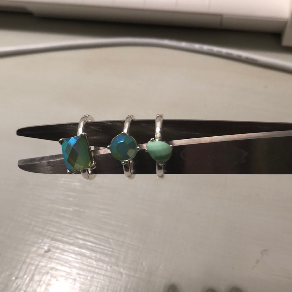 3 rings with aqua stone centers